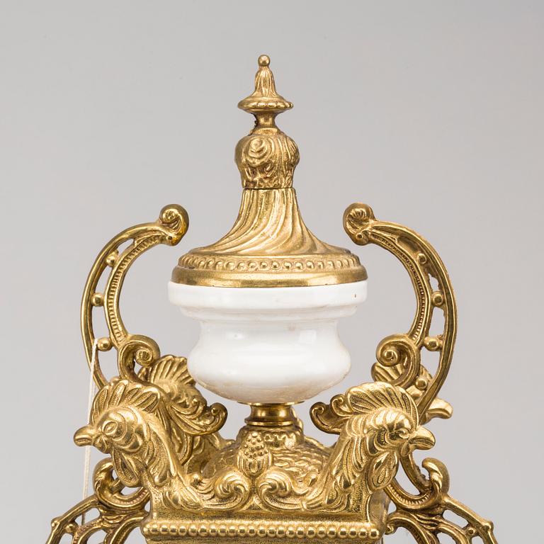 A LOUIS XVI STYLE GILT-BRASS CLOCK GRANITURE. Italy, SECOND HALF OF 20TH CENTURY.