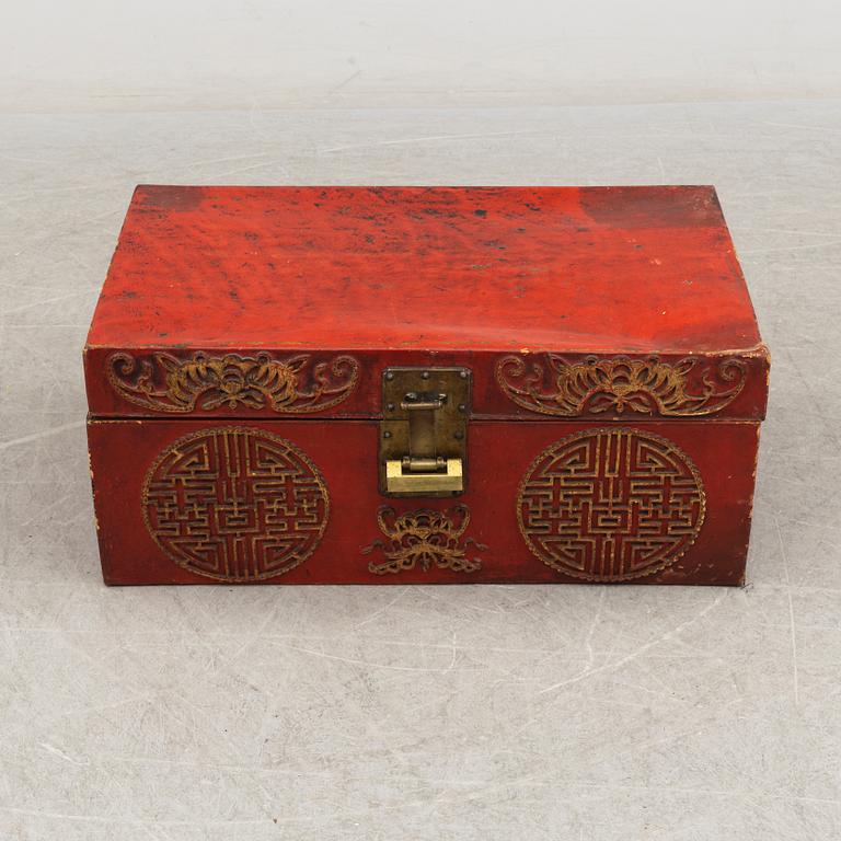 A Chinese red leather and wooden box, 20th century.