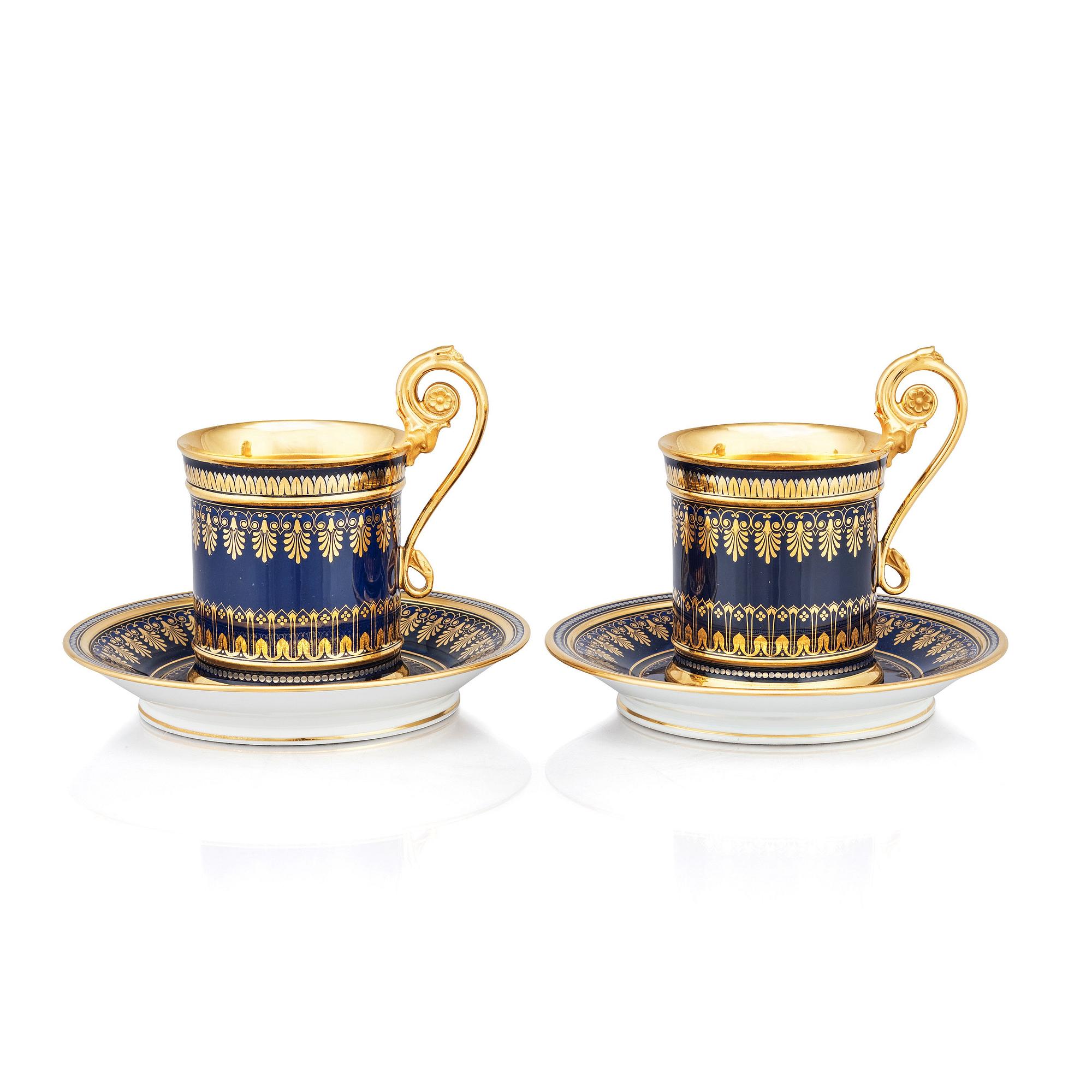 A pair of Sèvres cups with stands, 19th Century.
