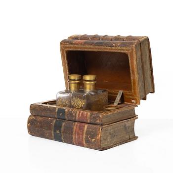 A case with a liqueur set, 20th century with older books.