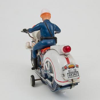 A Yoshiya robot and a Masudaya police motorcycle, Japan, 1960s.