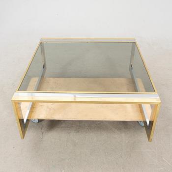 A glass and metal coffee table from Romeo Rega second half of the 20th century.