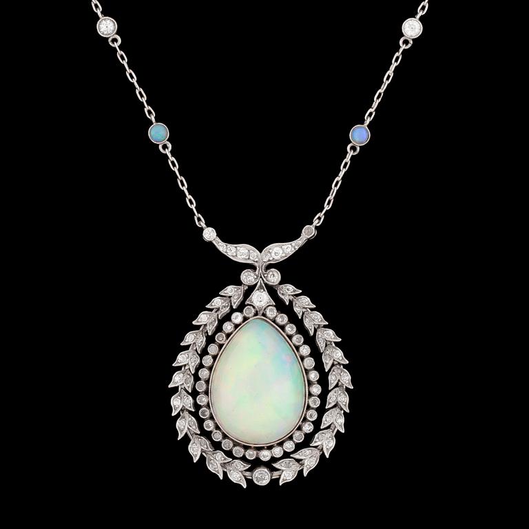 An opal and diamond pendant, 9.14 cts, resp. app. 1 ct.