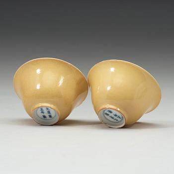 A pair of Imperial yellow bowls, Qing dynasty, Yongzheng six-character mark and of the period (1723-1735).