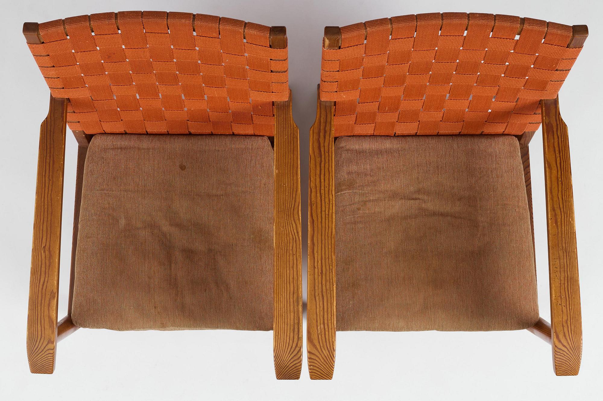 Axel Einar Hjorth, a pair of stained pine "Väddö" easy chairs, Nordiska Kompaniet, Sweden, 1930s-40s.