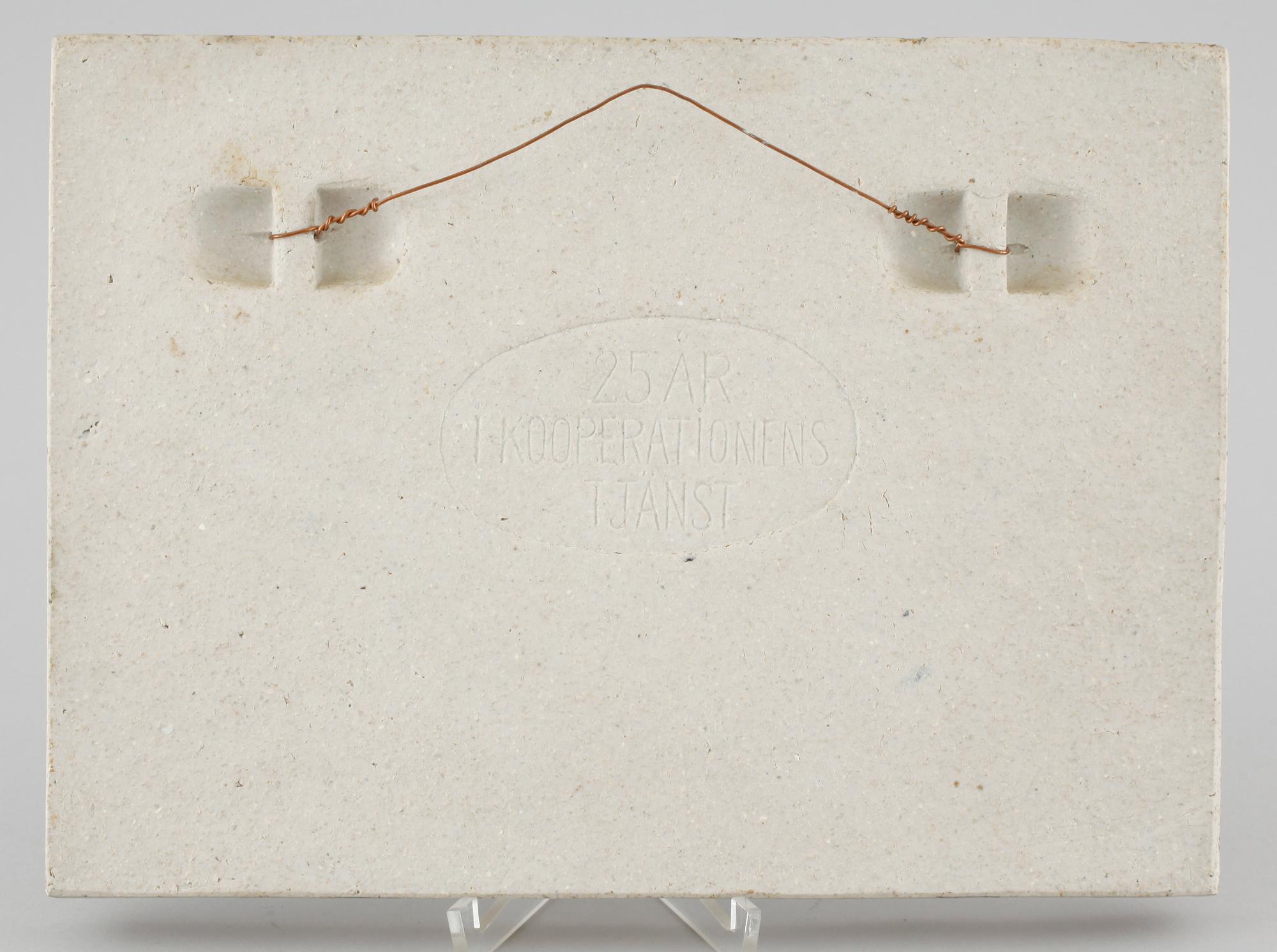 A stoneware wall plaque by Stig Lindberg, signed in the ceramics.