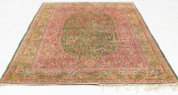 A semi-antique Kirman Carpet, circa 304 x 186 cm.