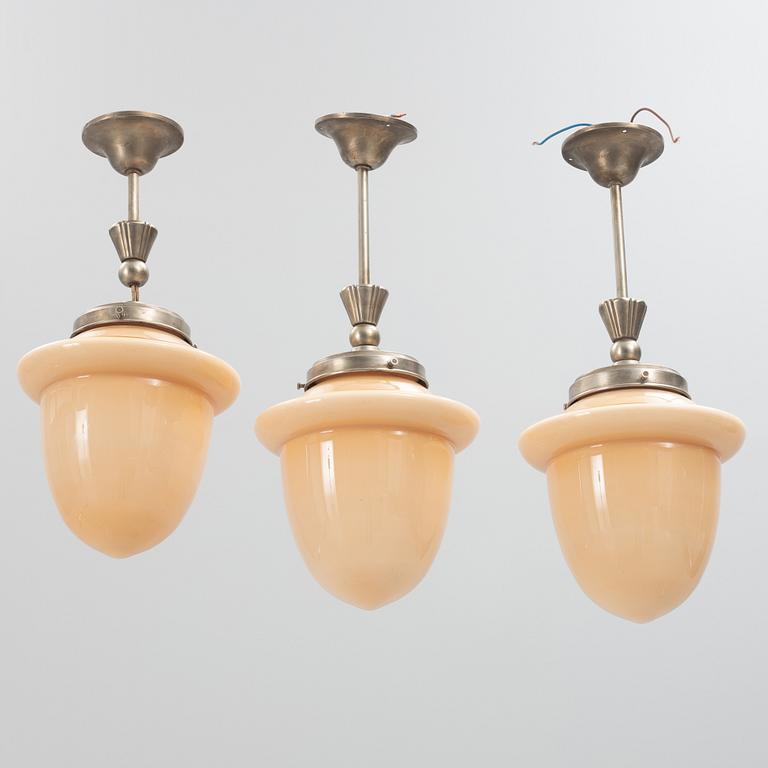 Three Swedish Grace ceiling lamps, 1920's.