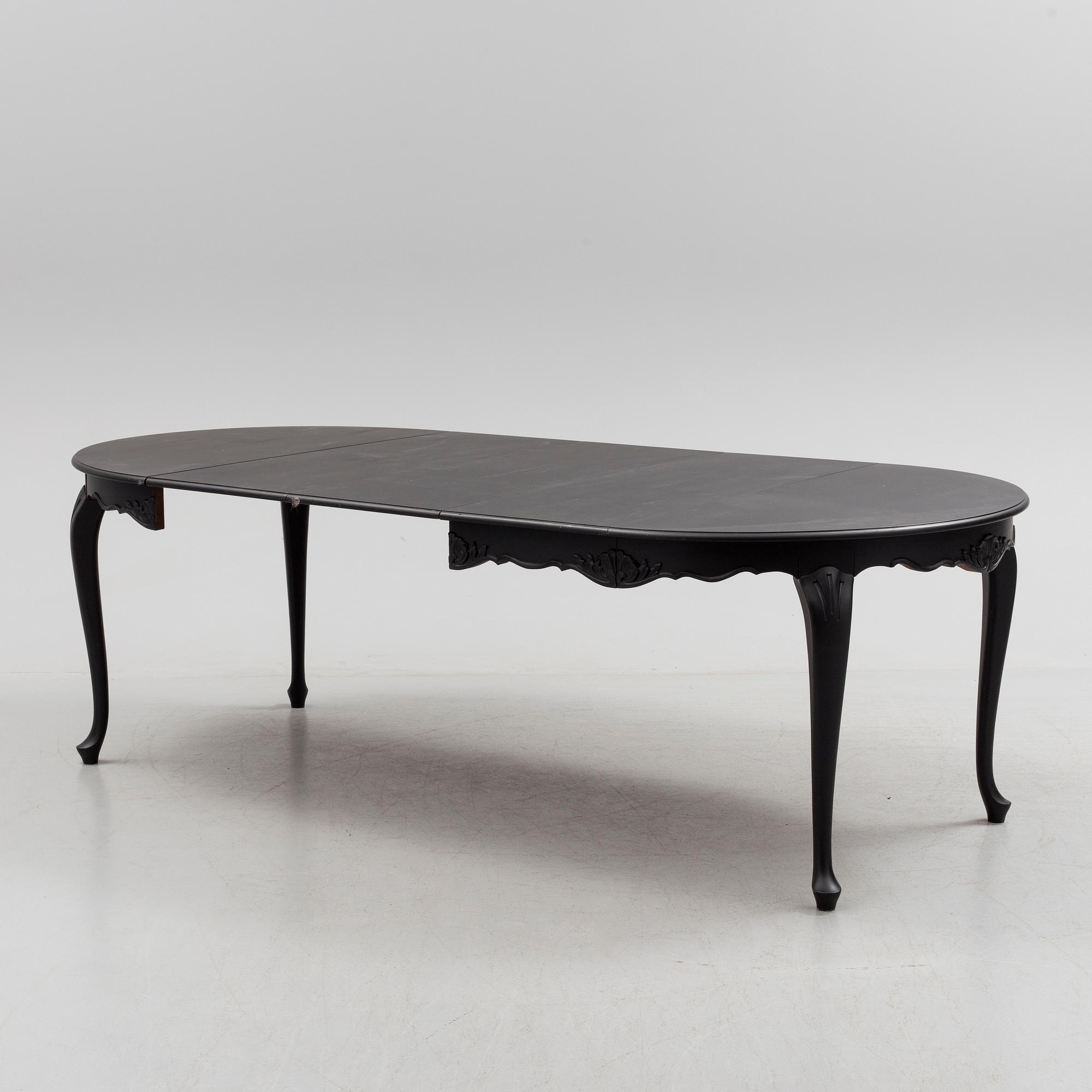 A mid 20th century rococo style dining table.