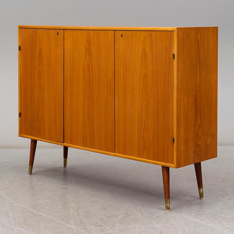 A late 20th Century teak veneered sideboard.