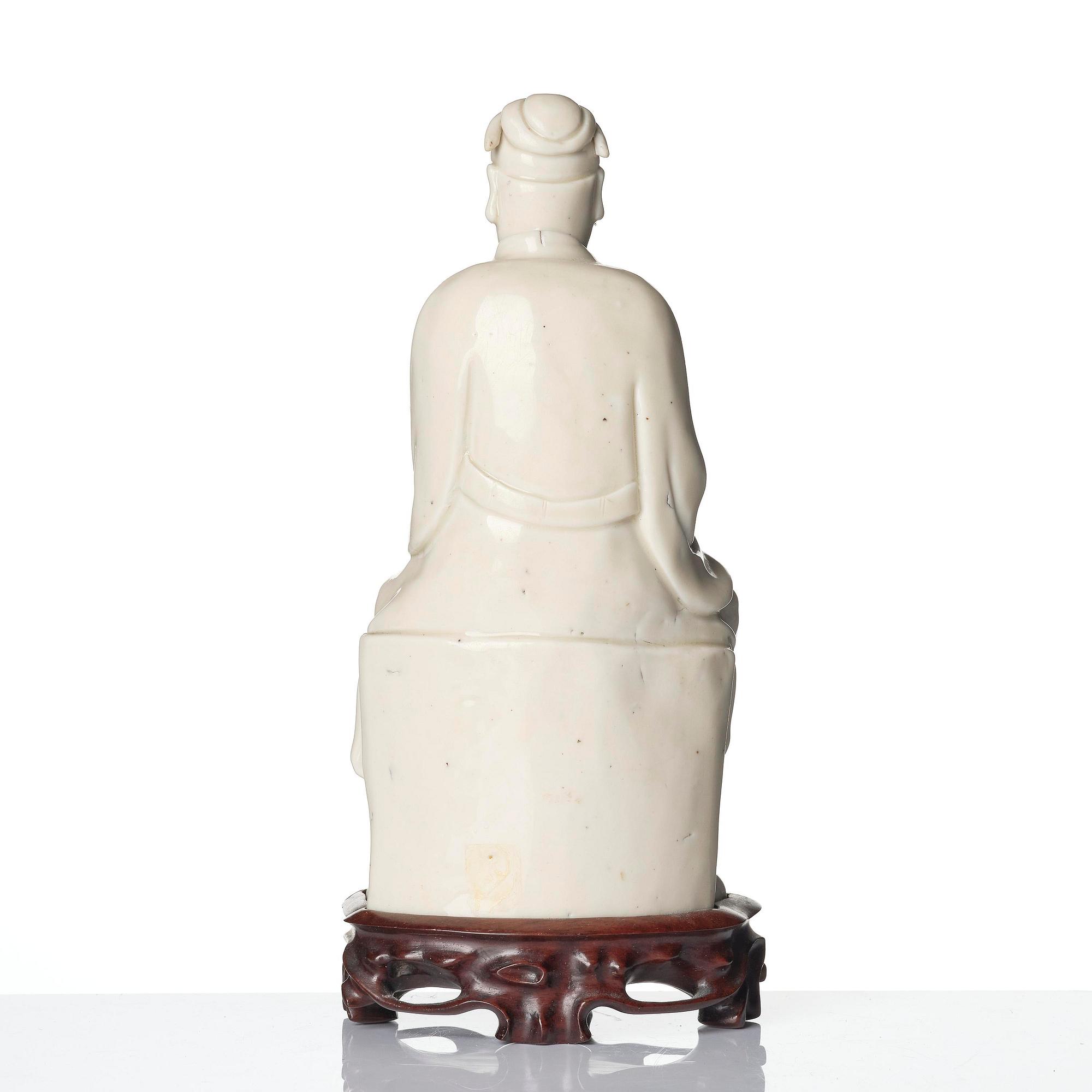 A blanc de chine figure of Guandi, Qing dynasty, 18th century.