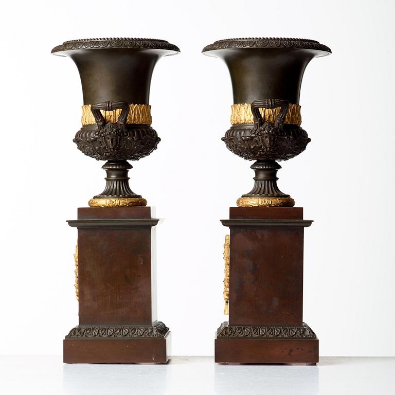 A pair of French Empire early 19th century urns.