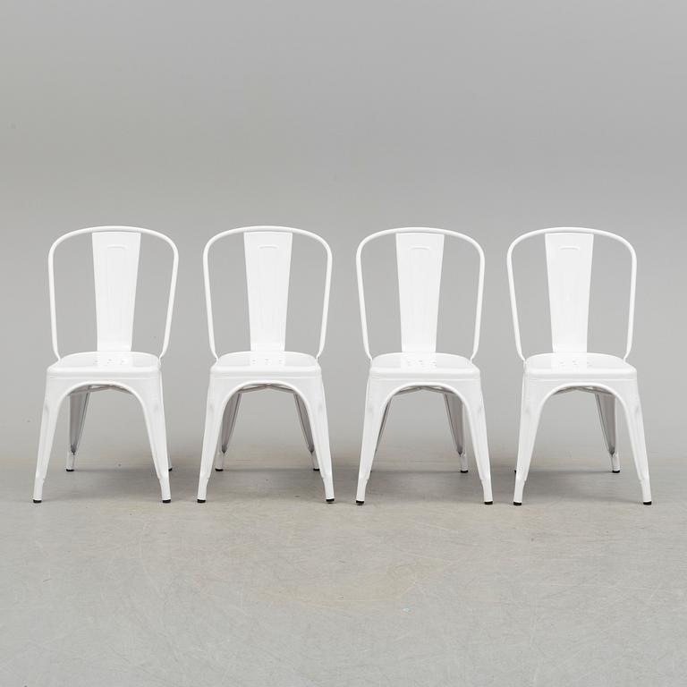 A set of four Tolix chairs.