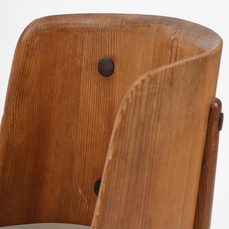 Axel Einar Hjorth, a pair of stained pine "Lovö" armchairs, Nordiska Kompaniet, Sweden, 1930s.