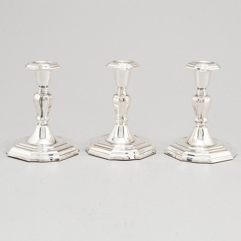 A set of three Swedish silver candlesticks, maker's mark CG Hallberg, Stockholm 1955-1957.