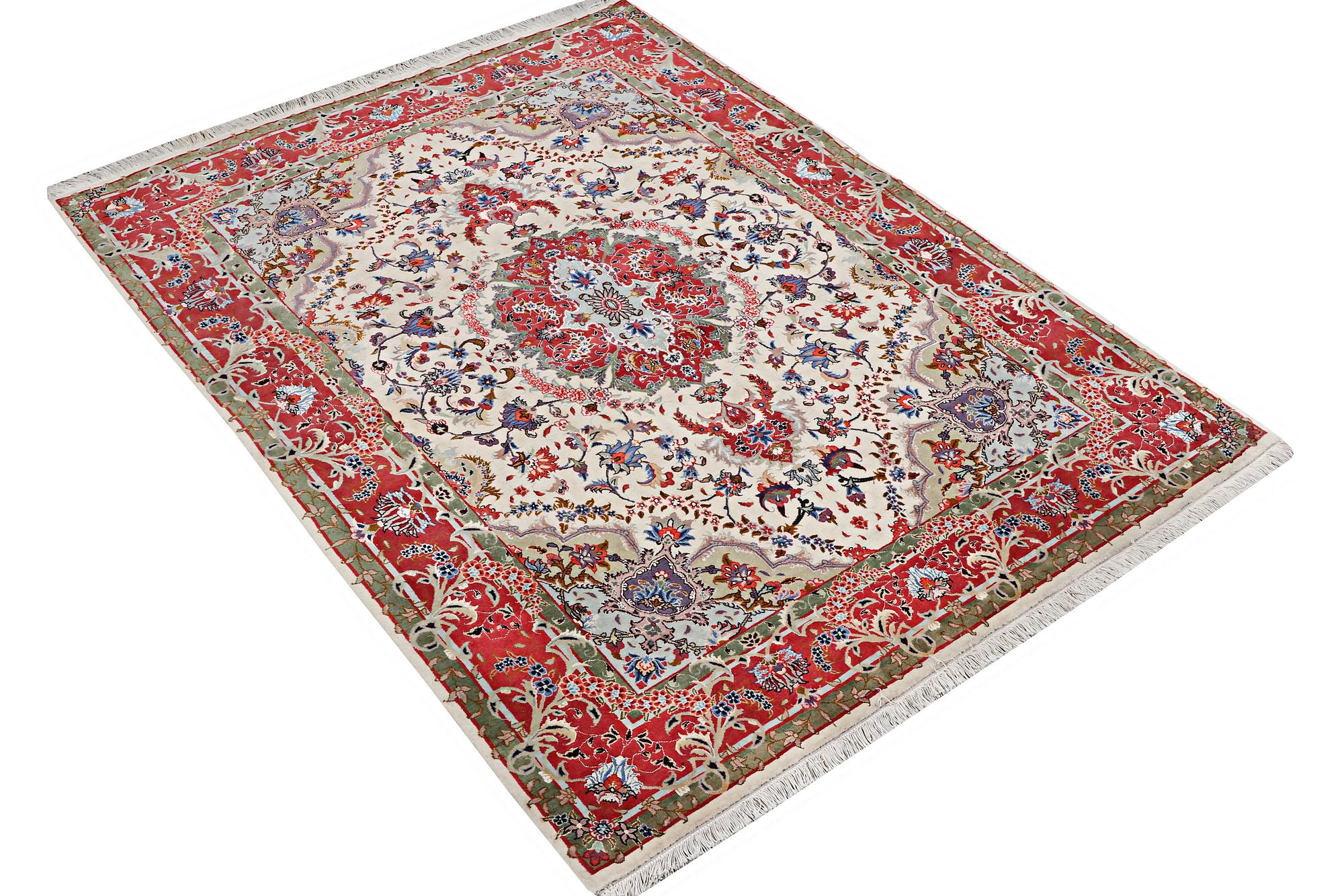 A Tabriz rug, part silk, 50 raj, c. 204 x 154 cm.