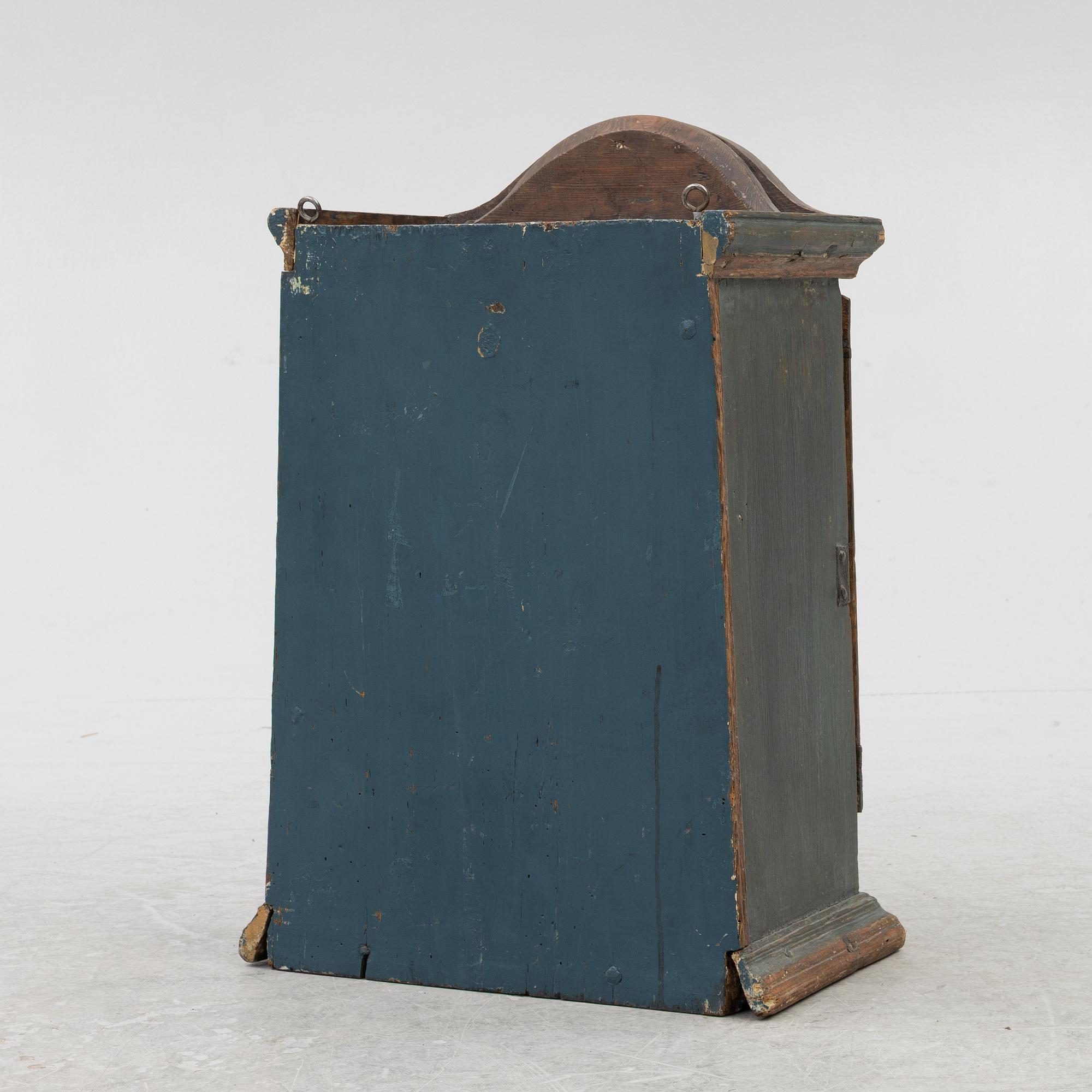 A painted wall cabinet, 19th century.