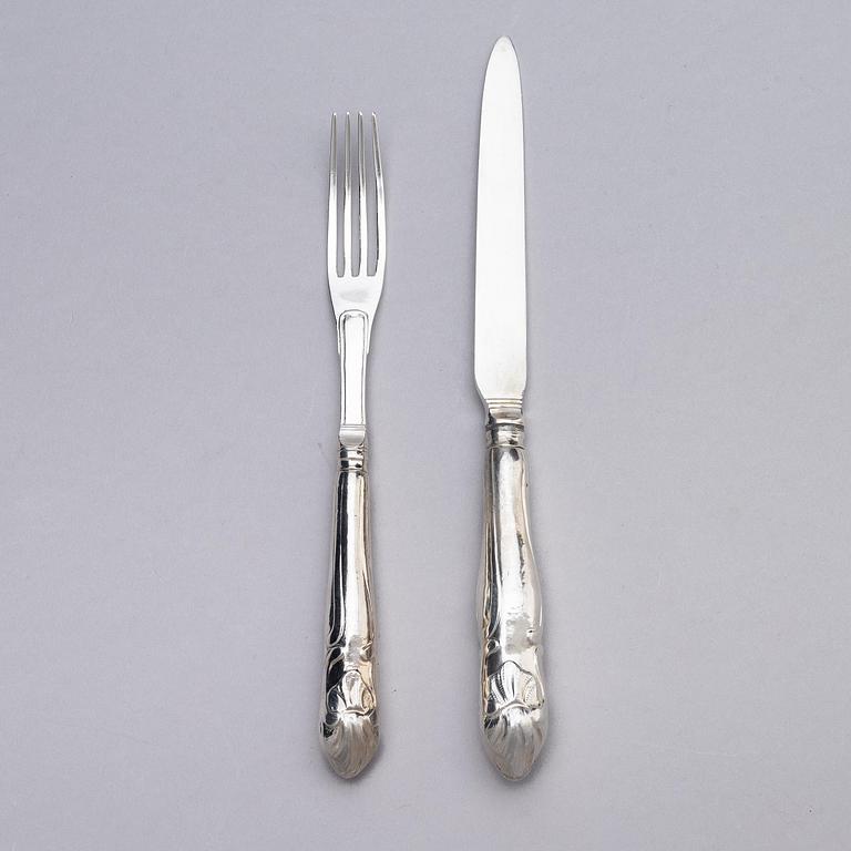A Swedish set of 19 piece silver table-cutlery, marks of  Isak Trybom, Stockholm 1779-1780.