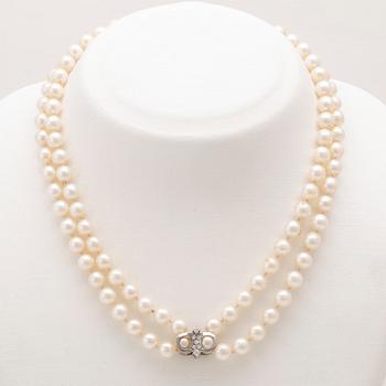 A necklace with cultured pearls and clasp in 18K white gold with round brilliant-cut diamonds, Hellström & Åhrling 1981.