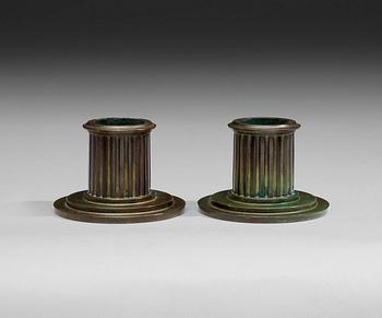 453. A pair of bronze candlesticks probably by Jacob Ängman GAB, Stockholm, 1920-30-tal.