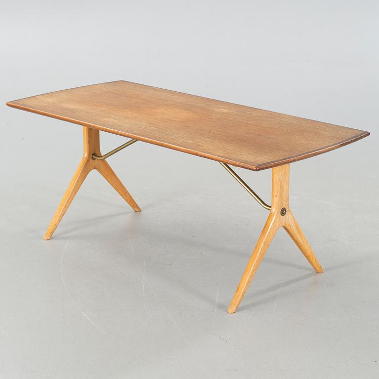 A "Krysset" sofatable, designed by Karl-Erik Ekselius for JO Carlsson, launched 1952.