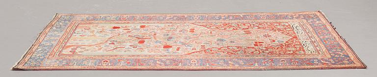 A RUG, a semi-antique Kashan Motachem figural, ca 211 x 134 cm.