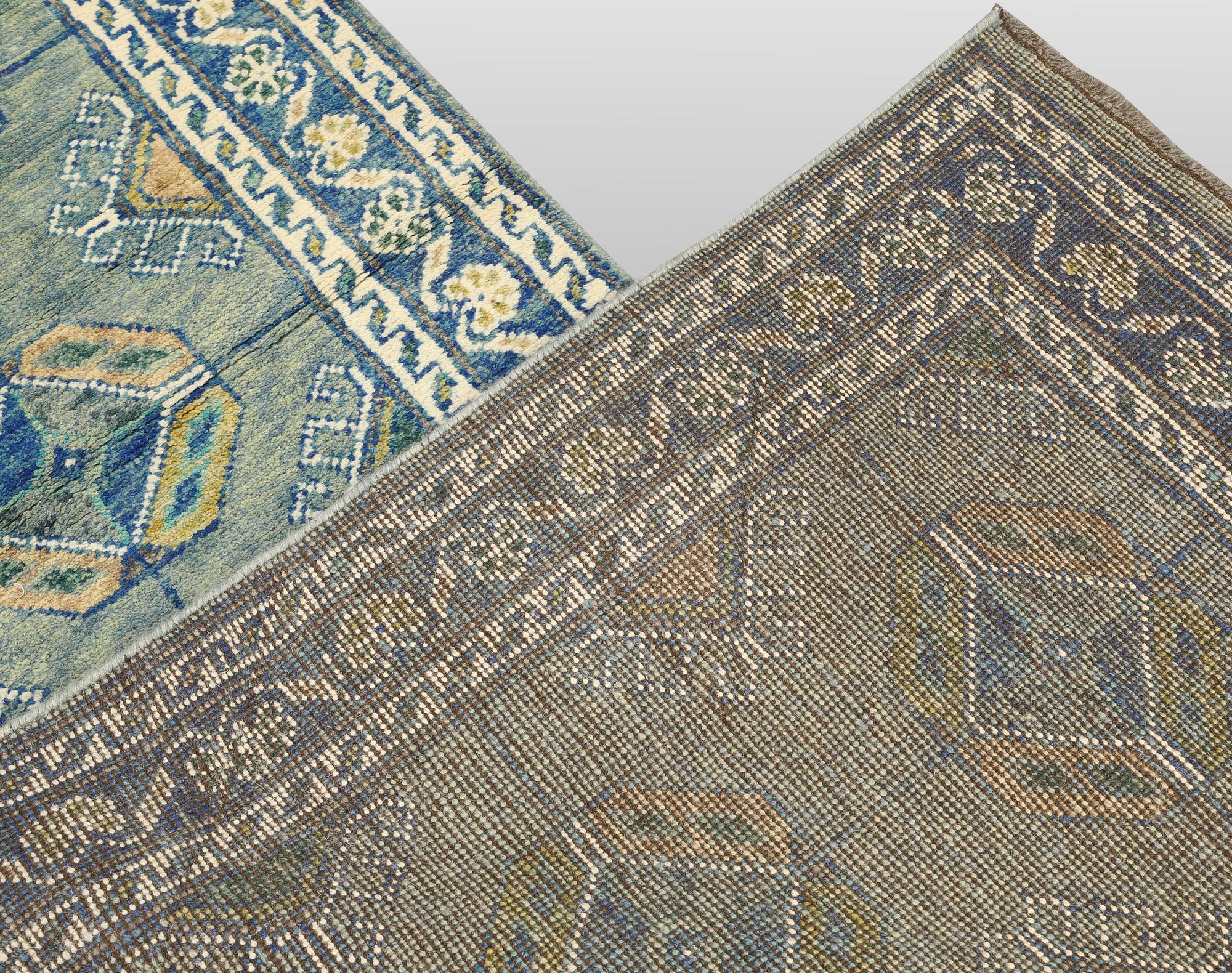 An Oriental runner, c. 393 x 79 cm.