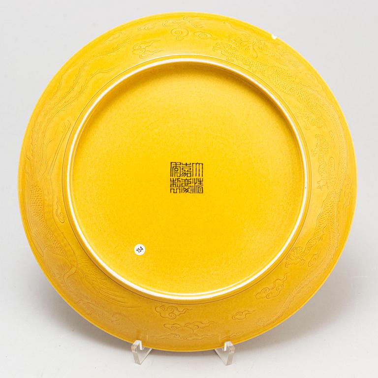 A Chinese yellow-glazed dish, 20th century.