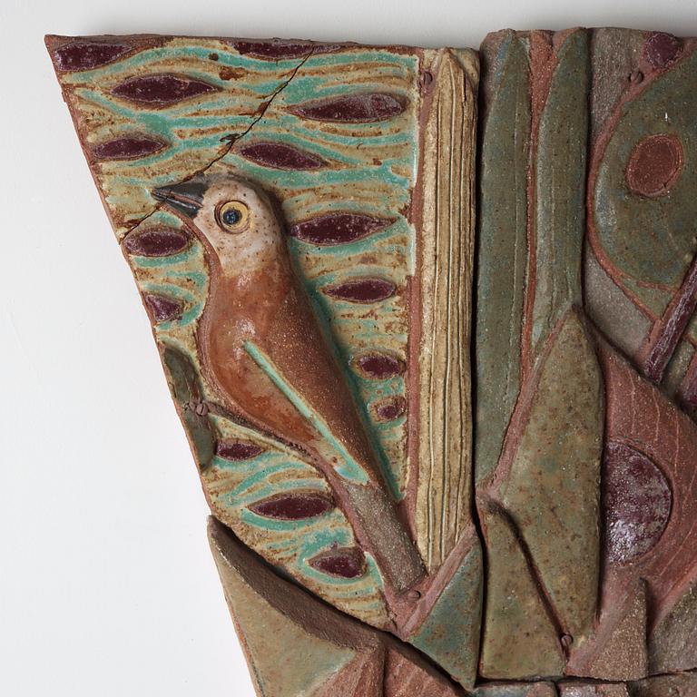 Tyra Lundgren, a stoneware relief 'A bird is singing at dawn among large leaves', Sweden 1950's.