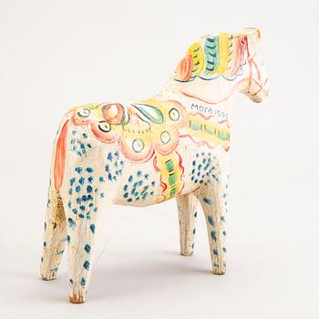A Swedish painted and dated 1945 wooden horse.