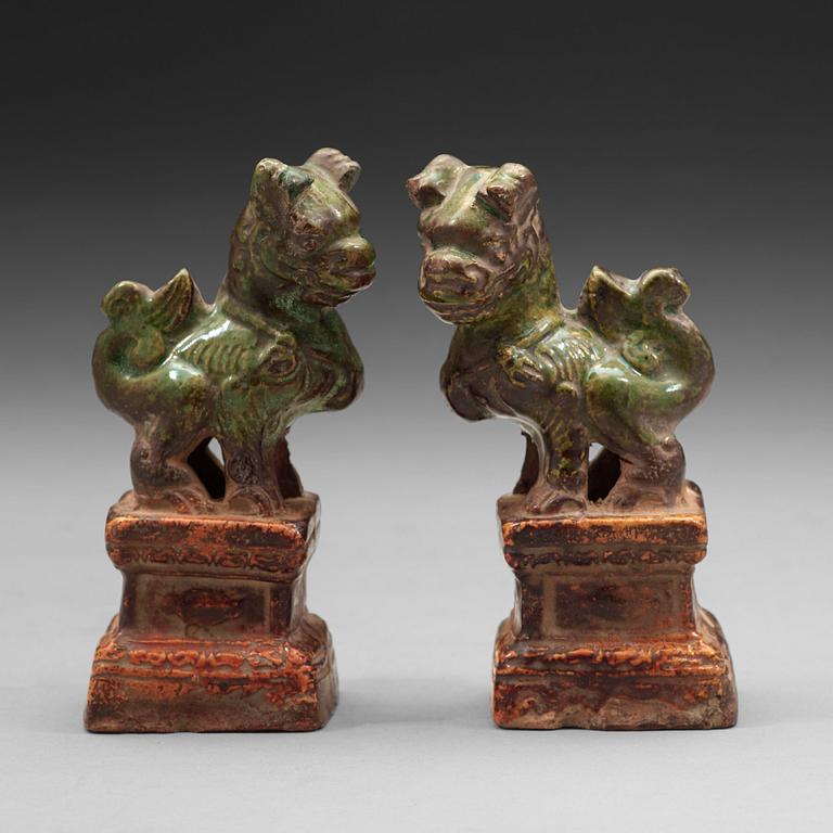 A pair of green and yellow glazed joss stick holders, Ming dynasty (1368-1644).