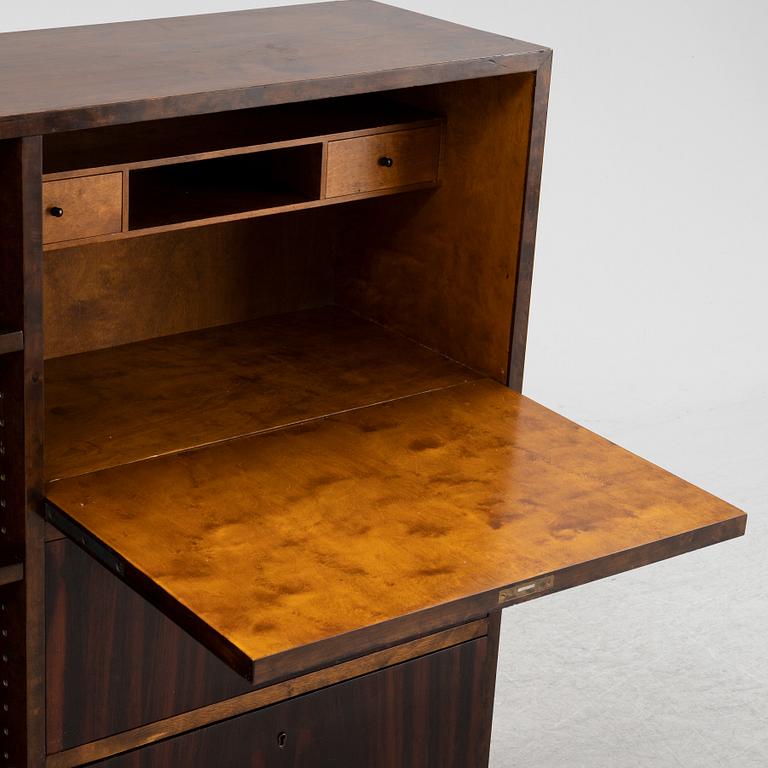 A 1930s stained birch and rosewood secretaire and bookcase.
