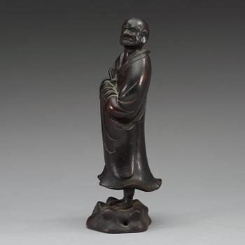A bronze figure of one of the Lohans, Qing dynasty (1644-1912).
