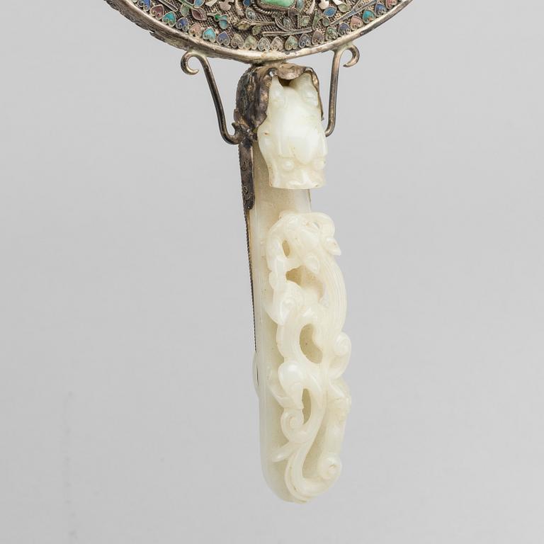 A Chinese silver mirror with carved nephrite placque and belt hook, early 20th Century.