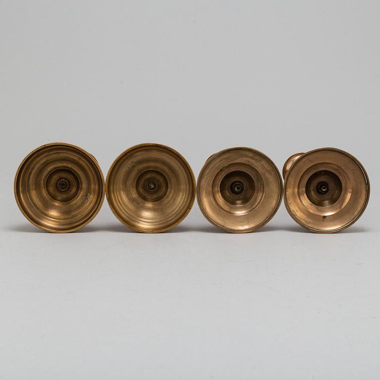 Four (2+2) brass candle holders, including Skultuna.