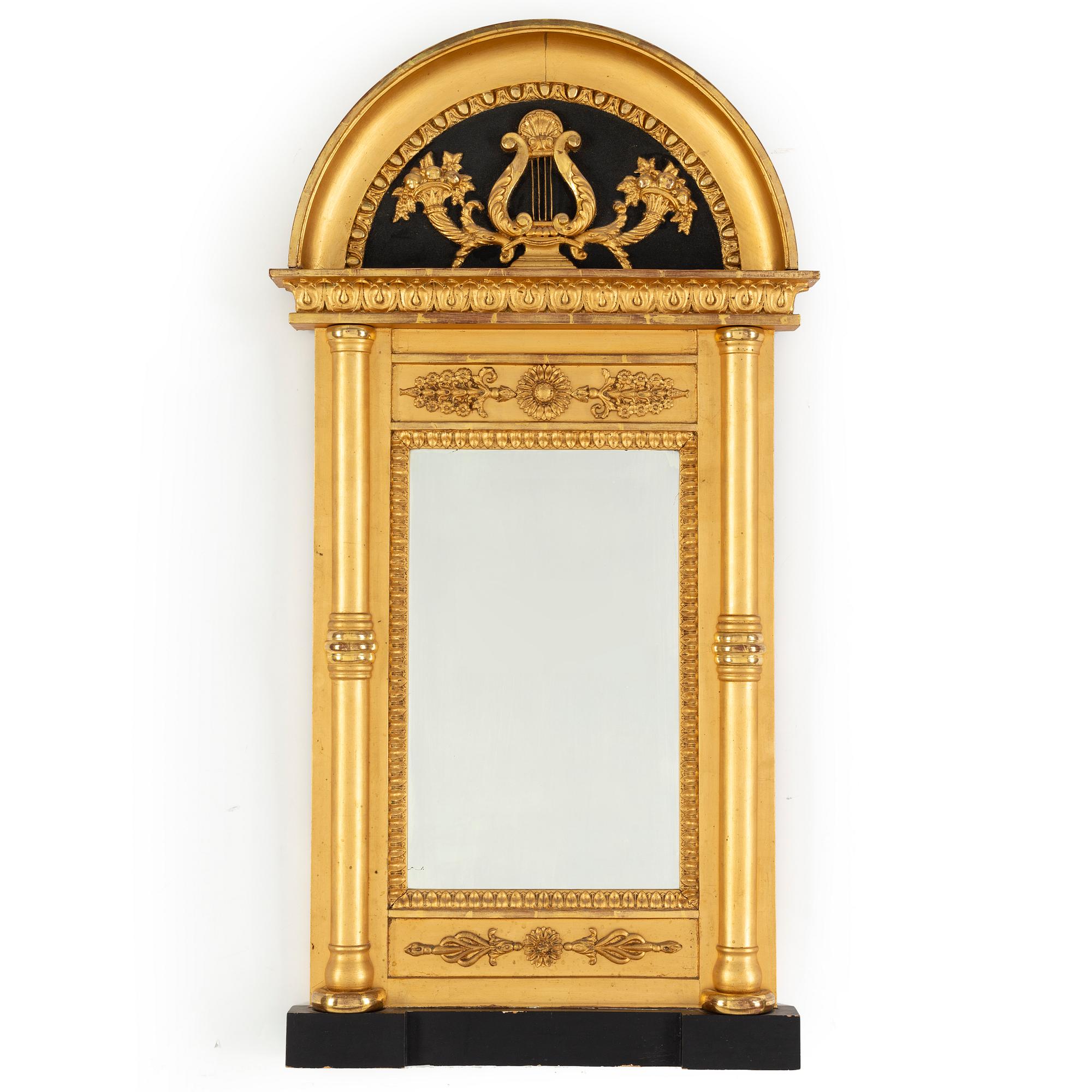 A 20th century Empire style gilt mirror.