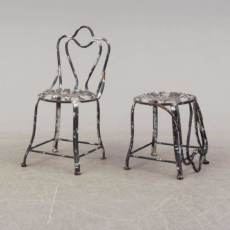 a pair of modern iron graden chairs,