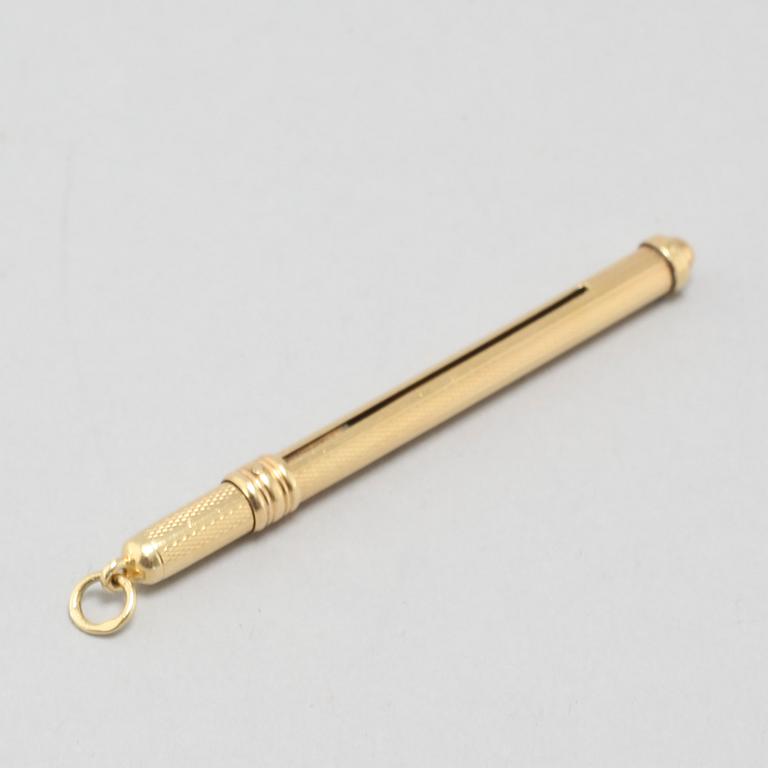 An 18k gold champagne whisk.