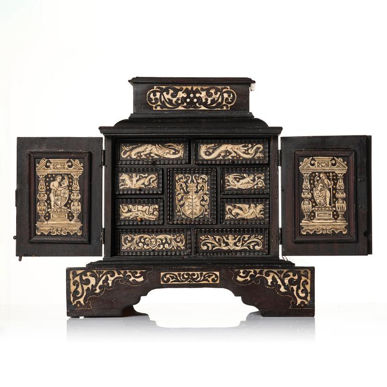 A South German, presumably Augsburg, ebony, ebonised and engraved bone inlaid table cabinet,  17th century.