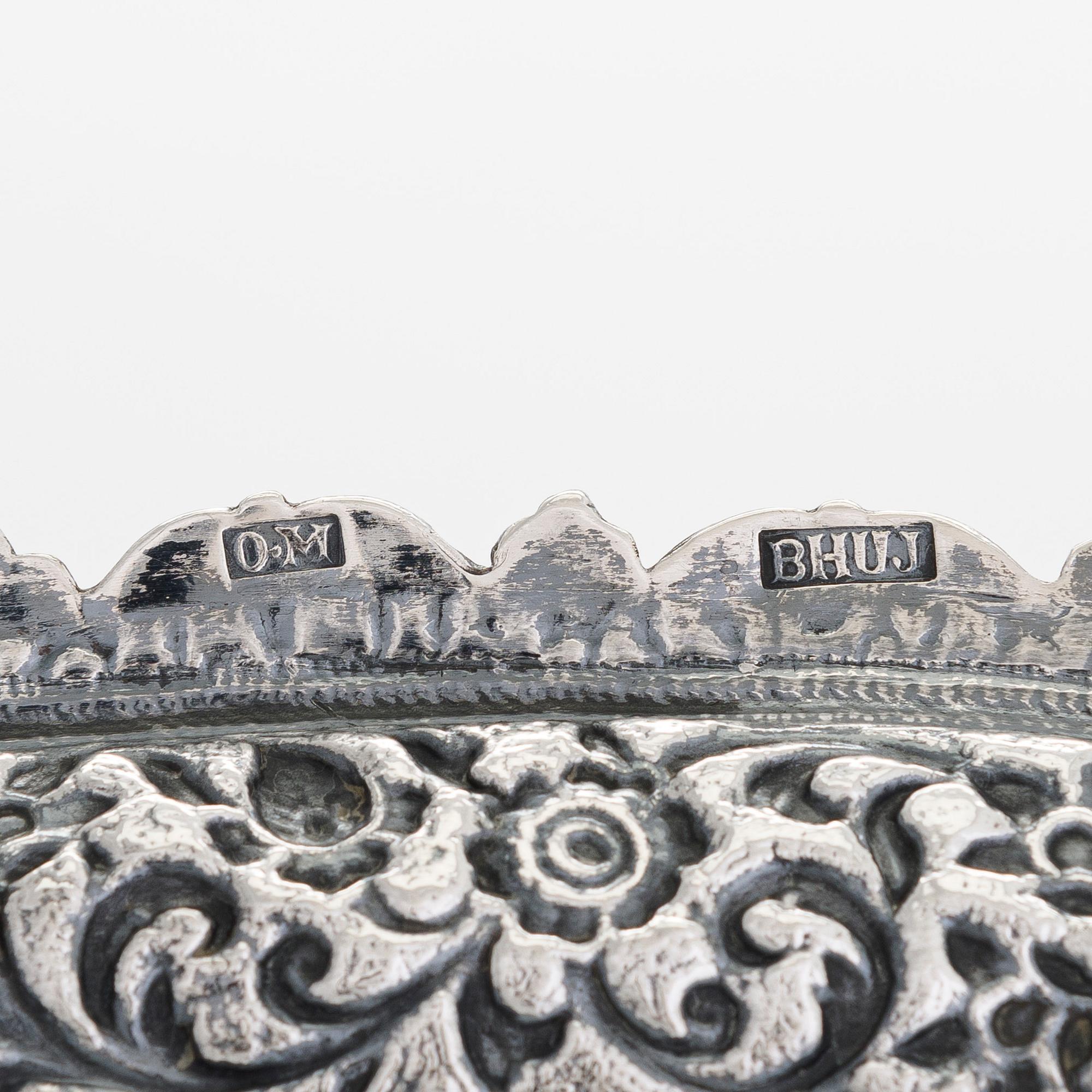 A silver salver, marked OM BHUJ for Oomersi Mawji, Bhuj, Kutch, India, circa 1860-1890.