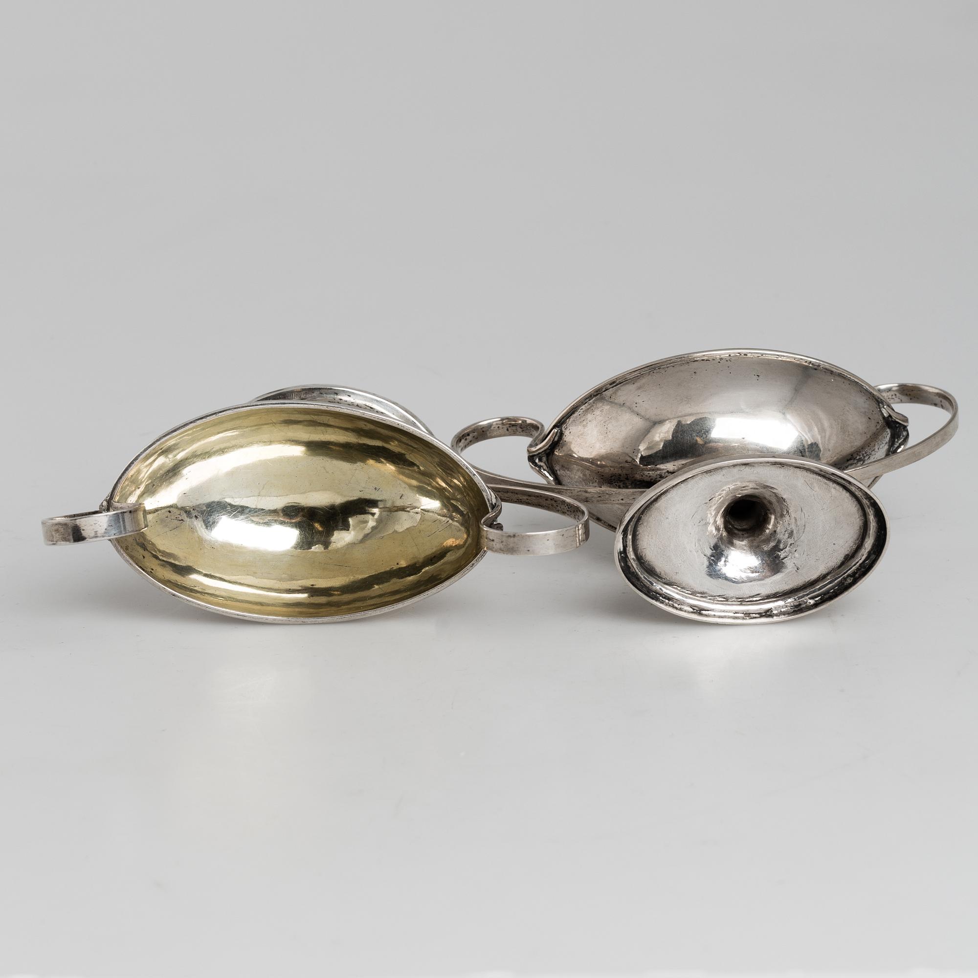 A pair of firt half of the 19th century parcel-gilt silver salt-cellars by an uknown master, one marked HB.