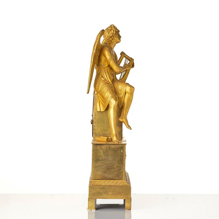 A figural Empire ormolu mantel clock, Paris, early 19th century.