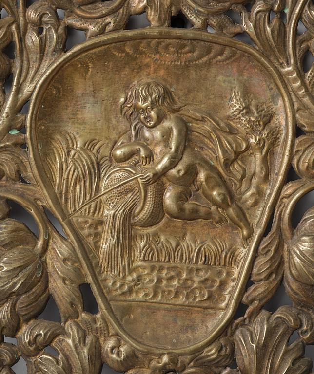 A set of four Swedish Baroque repoussé silvered brass reflector one-branch reflector plates, ca 1690-1700.