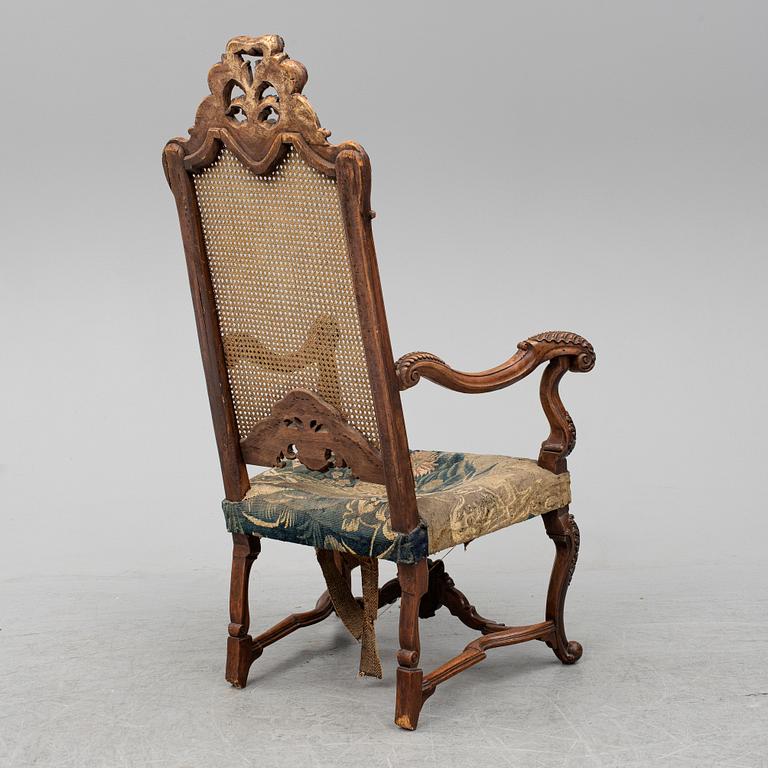 A 19th century baroque style armchair.
