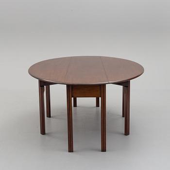 A DINING TABLE, England, made for NK, Nordiska Kompaniet, Sweden. Signed with label. Probably 1960s / 70s.