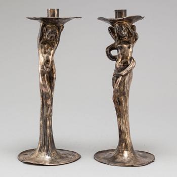 A 20th Century pair of art noveau style candle sticks marked A.W.OX.