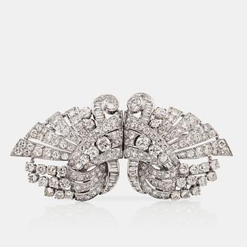 A brilliant-cut diamond brooch/clips in the shape of two swans. Circa 1940's. French hallmarks.