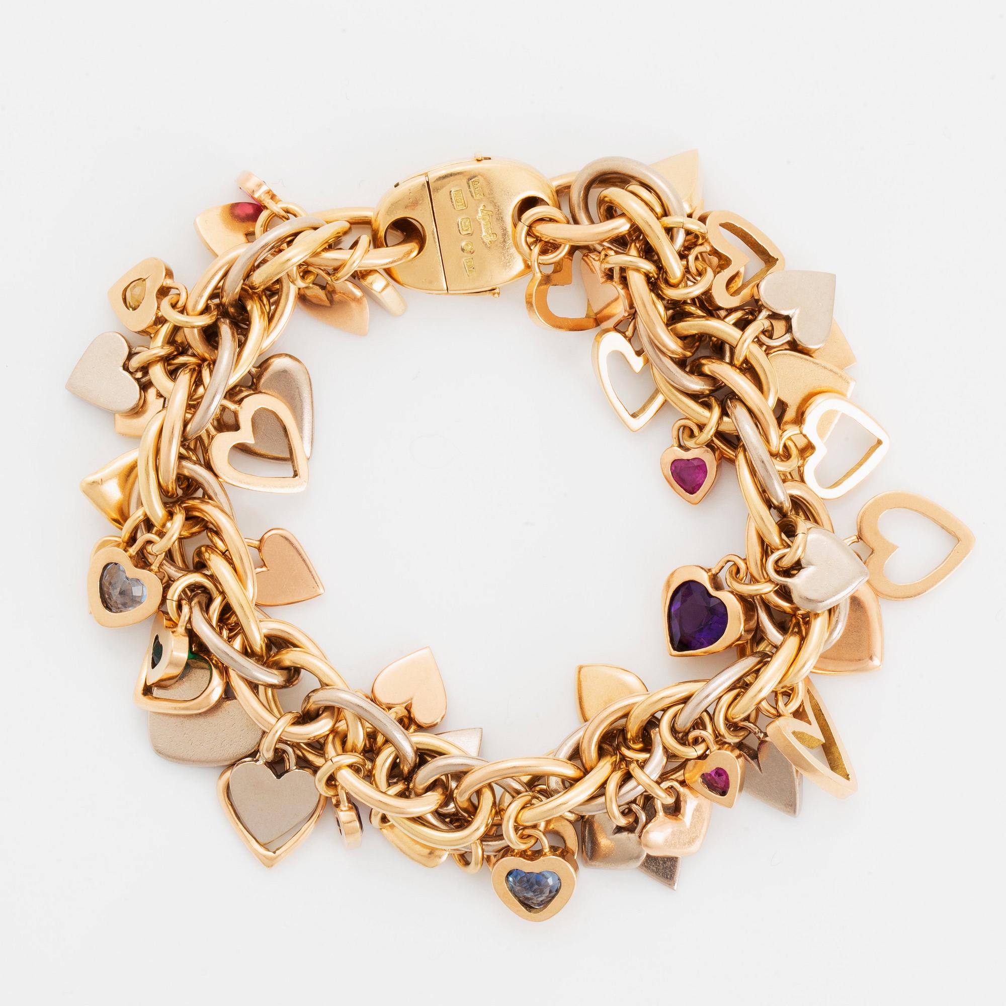An 18K gold Gaudy bracelet with heart shaped charms.