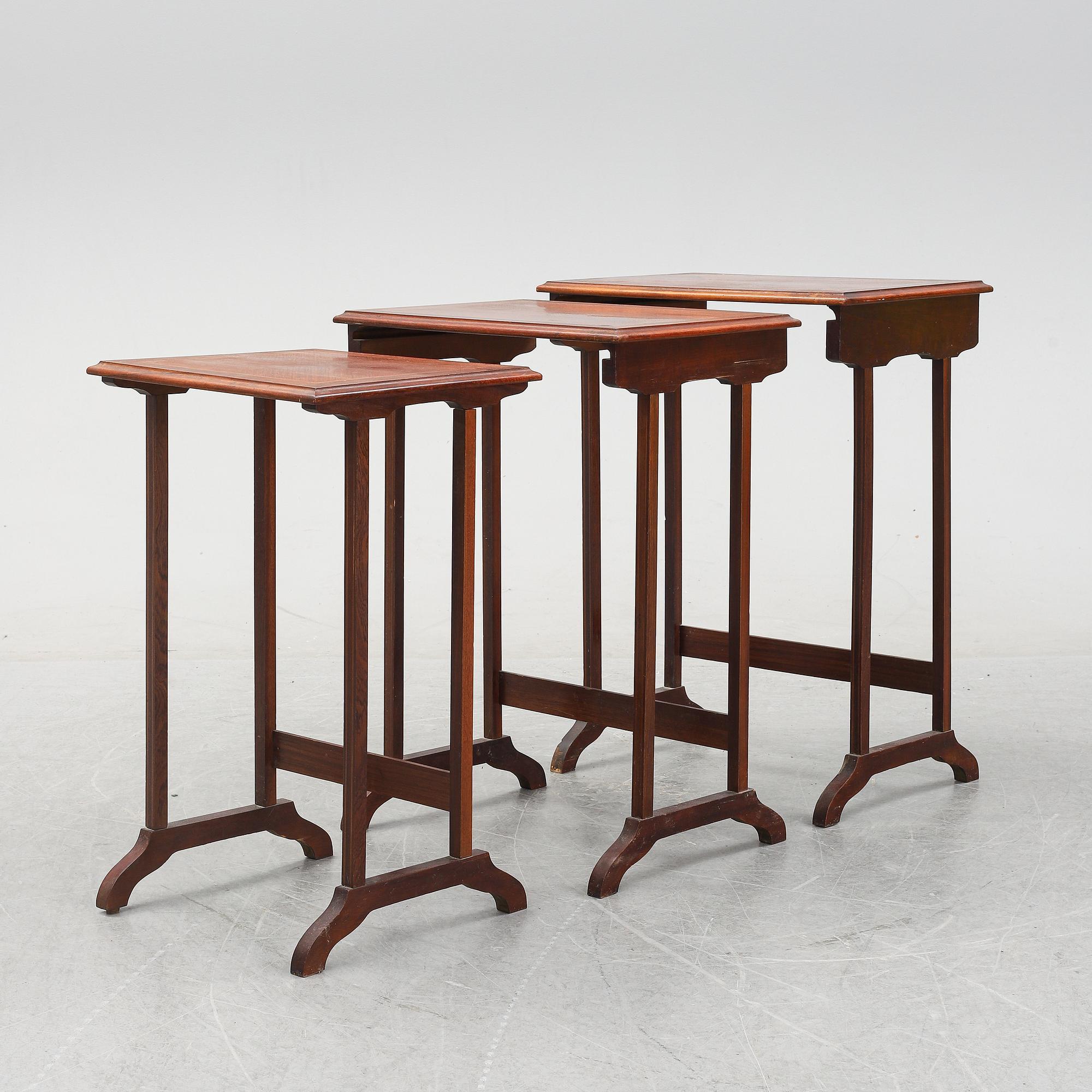 A three piece nesting table with inlay, first half of the 20th Century.