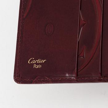 Cartier, plånböcker 3 st samt nyckelring.